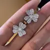 Pendientes de botón Huitan Rueda de la suerte de trébol para mujer TEMU nuevos pendientes populares pendientes de flor exquisita moda