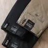 Estación europea pantalones casuales de alta gama para hombre otoño e invierno nuevos de lyocell antiarrugas microelásticos caqui negocios sueltos rectos