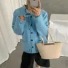Cárdigan de punto estilo coreano con cuello solapa, detalle de corbata y bolsillos, un nuevo diseño otoño/invierno para mujer, simple, versátil y juvenil, que irradia un ambiente elegante