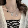 Novo Estilo Colar de Pérolas Ins para Mulheres, Corrente de Gola para Suéter Versátil de Luxo Leve de Nicho com Pingente de Coração e Borboleta Atacado
