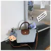 Bolso Longchamp Nuevo Transfronterizo con Colores Contrastantes, Bolso de Mano de Mezclilla, Nuevo Modelo 2026, Bolso Tipo Dumpling de Alta Gama, Bolso de Hombro y Cruzado de Moda