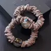 Accesorios para el cabello de Corea del Sur al por mayor súper suave para el cuidado del cabello cuerda para la cabeza cola de caballo de mujer banda de goma de alta elasticidad cabeza de bola cuerda para el cabello duradera nueva