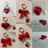 Chaveiro Laço Coração Vermelho Moda Versátil Chaveiro de Bolsa Pequeno Pingente de Chave Coração de Pêssego