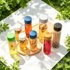 Suministro Directo de Fábrica Botella Infusora de Té Redonda de Vidrio con Tapa Sellada Taza para Bebidas de Jugo de Frutas Botella de Vidrio Transparente de Cilindro Recto para Agua Mineral