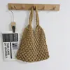 Bolso tejido de red hecho a mano estilo INS para mujer, nuevo bolso de paja transfronterizo, bolso de playa para vacaciones, bolso popular de influencer
