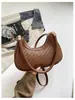 Bolsa feminina estilo explosivo transfronteiriça 2026 nova moda versátil transversal bolsa bolinho simples trançada de ombro único sob o braço para mulheres