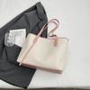 Bolso de gran capacidad de comercio exterior para mujer, primavera y verano 2025, nuevo bolso de hombro portátil a juego, bolso de mano de clase para ir al trabajo.