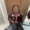Bolso de mano tipo almohada de alta moda retro para mujer, nuevo estilo otoño e invierno 2026, bolso de hombro elegante, bolso cruzado versátil para el día a día
