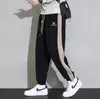 Pantalones deportivos de pana pesada Pantalones de chándal casuales para hombre Otoño/Invierno con forro polar Engrosados talla grande Pantalones color block holgados