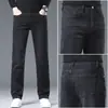 Nuevos jeans negros de alta gama para hombre, corte recto ajustado, pantalones casuales elásticos versátiles para primavera y otoño