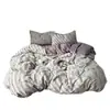 Conjunto de cama de quatro peças em gaze dupla para mãe e bebê, grau A, com estampa floral retrô, incluindo uma capa de edredom, um lençol de elástico e um conjunto de lençol de três peças para dormitórios.