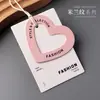 Etiqueta colgante de ropa con diseño de corazón hueco Logo Etiqueta de precio Etiqueta colgante de ropa Ropa de mujer Ropa de niño Tarjeta colgante Ropa de niño