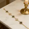 Venda Direta de Fábrica Pulseira de Aço Inoxidável com Galvanoplastia, Novo Modelo Popular de Nicho 18K, Série Linguagem das Flores Joias de Trevo de Quatro Folhas