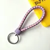 Llavero creativo de cuerda de cuero tejido a mano para pareja, llavero de coche, llavero al por mayor, colgante para bolso