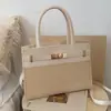 Bolso de mujer de alta gama, nuevo modelo otoño 2026, bolso de axila para el día a día, diseño de nicho moderno y simple, bolso de hombro y cruzado