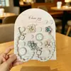 Zueco de lujo ligero con forma de trébol de cuatro hojas y diamantes rosas, accesorio para zapatos con agujeros calados, cadena de diamantes, decoraciones de alta gama para DIY, desmontable, venta al por mayor