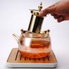 Tetera de vidrio de borosilicato al por mayor transfronteriza con forro interior de acero inoxidable engrosado resistente al calor, mango de cobre, tetera tipo olla con asa de viga, tapa para té