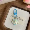 Chaveiro Cabeça de Orquídea Colorida com Laço Pingente de Flor Simulada Fofa Pingente de Chaveiro para Mochila de Cura