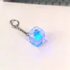 Llavero creativo de alta transparencia con cuatro botones y probador de interruptor iluminado, gadget para aliviar el estrés, juguete colgante transparente iluminado, regalo