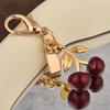 Colgante para llave de coche, bolso de gran sentido, accesorios de color dorado, oso, cereza, trébol de cuatro hojas, mariposa, bolso escolar, joyería al por mayor