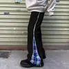 Calças largas plus size, com design de padrão xadrez patchwork estiloso, adequadas para homens e mulheres, e perfeitas para primavera e outono