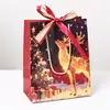 Bolsas de regalo navideñas de comercio exterior transfronterizas, bolsas de mano de tarjeta blanca con Santa Claus, bolsas de regalo rojas y azules, bolsas de embalaje de fruta de la paz en stock