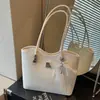 Bolso de hombro con lazo estilo coreano 2026 transfronterizo para mujer, bolso de axila de nicho, bolso tipo cubo moderno y simple para el trabajo diario para mujer