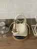 Bolsa de Mano Cruzada Primavera y Verano Nuevo 2026 Coreana de Nicho Bolsa de Empanada Bolso Tejido Bolso Cubo con un Toque de Lujo y Diseño Exquisito Bolso Cruzado