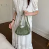 Bolso de Mano Tejido Hueco de Diseño de Nicho para Mujer 2026 Nuevo Bolso de Hombro Casual Estilo Resort de Playa de Alta Gama