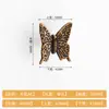 Manija moderna de lujo ligero estilo chino de mariposa simulada de aleación de zinc para instalación en puertas de sala de estar, dormitorio, cajones, gabinetes y alacenas