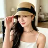 Gorra de béisbol popular de paja negra con lazo para primavera y verano para mujer, adecuada para la playa, vacaciones junto al mar, actividades ecuestres y protección solar