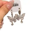 Pendientes de Mariposa Deslumbrantes de Diamante Completo Estilo Palacio, Temperamento de Lujo Ligero, Versátiles y Únicos Pendientes de Botón de Estilo Celebridad de Internet de Gama Alta para Mujer