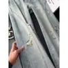 Jeans rectos de estilo retro americano con estampado de olas azul claro, unisex, con un diseño de pierna ancha y fluido, corte holgado, y disponibles en estilo para pareja para uso casual; al por mayor