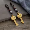 Colgante de llave de bóveda abierta con lingote de pez doble del zodíaco de imitación de latón, colgante de cuerda de nube auspiciosa de los doce zodíacos, venta al por mayor