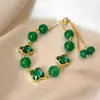 Pulsera de Trébol de Cuatro Hojas con Perlas de Cristal Morado para Mujer, Estilo Coreano, Lujo Ligero, Nicho, Exquisita, Sensación de Alta Gama, Joyería Elegante para la Mano