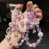 Colgante de Lazo Rosa con Perlas de Gama Alta Cadena para Teléfono Móvil de Lujo Accesible Colgante para Colgar en Bolsos de Lujo Accesible de Nicho para Mujeres Cordón para Teléfono Móvil