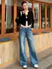 Jeans retos com lavagem retrô para mulheres, nova coleção outono 2026, corte solto, emagrecedor, versátil, com caimento fluido e design de perna larga, comprimento até o chão