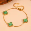 Moda transfronteriza acero inoxidable flor de tres cuatro hojas joyería Europa y Estados Unidos nuevo acero de titanio no se decolora traje de joyería de flor pequeña