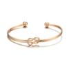 Joyería simple de alta gama con brillo metálico europeo y americano, diseño geométrico de nudo cruzado, pulsera de joyería con abertura en forma de c