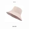 Sombrero de pescador de rayas unisex estilo nuevo primavera y verano, versátil para viajes, protección solar y sombrero tipo cubo de copa redonda para estilizar el rostro