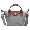 Bolso tote nuevo de gran capacidad para mujer 2026, bolso de hombro de nailon para ir al trabajo, moderno, simple, versátil y con un toque de alta gama