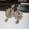 Pendientes colgantes de rombos con borlas tachonados de diamantes de aguja de plata transfronterizos europeos y americanos, pendientes exquisitos y de moda, pendientes versátiles y elegantes al por mayor
