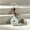 Colgante de bolsa giratorio de nueve casillas de doble cara estilo étnico, llavero, colgante, accesorio, regalo pequeño, al por mayor