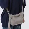 Bolsa de Ombro para Homens e Mulheres 2026 Novo Estilo Japonês Simples Bolsa de Lona Jeans Bolsa Transversal Bolsa Mensageiro de Aula para Estudantes Universitários