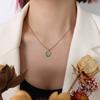 Collar con colgante ovalado de piedra de ojo de gato para mujer, joyería de nicho de acero de titanio transfronterizo de lujo ligero retro francés, venta al por mayor de fábrica