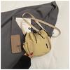 Bolso bandolera de hombro único de estilo coreano para comercio exterior, bolso de cubo fresco con cordón para mujer, bolso de hombro pequeño casual de nailon texturizado transfronterizo