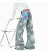 Calça jeans estilo americano lavada com estampa de estrelas para homens e mulheres, calça casual de design outonal estilo rua, calça longa solta de nicho