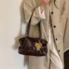 Bolso de mano de estilo relajado, bolsa grande de capacidad casual para commuting para mujer, nuevo modelo 2026, bolso de hombro de alta gama para debajo del brazo