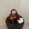 Bolso tipo Boston transfronterizo de nicho para mujer, nuevo bolso de hombro de moda 2026 con patrón de diamantes, bolso bandolera de cadena exquisito