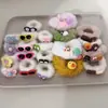 Puesto de网红 mercado nocturno patrón de un dólar accesorios para el cabello pinza para el cabello al por mayor tocado de dibujos animados tocado cuerda puesto de joyería pinza para el cabello mercancía